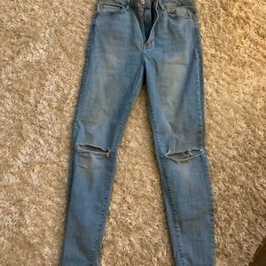 High waisted light wash ripped skinny jeans